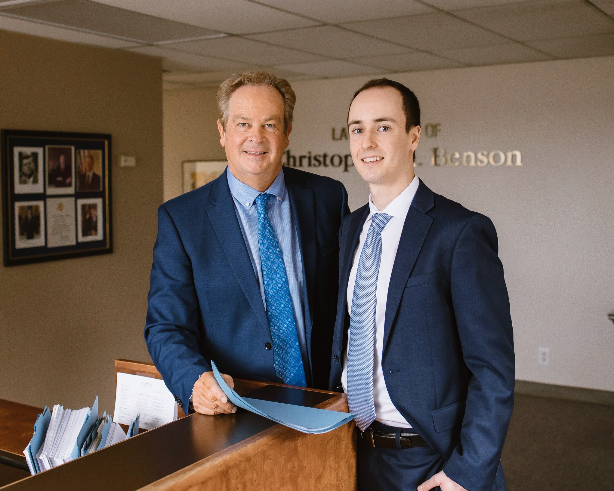 Chris and Logan at the law office front desk