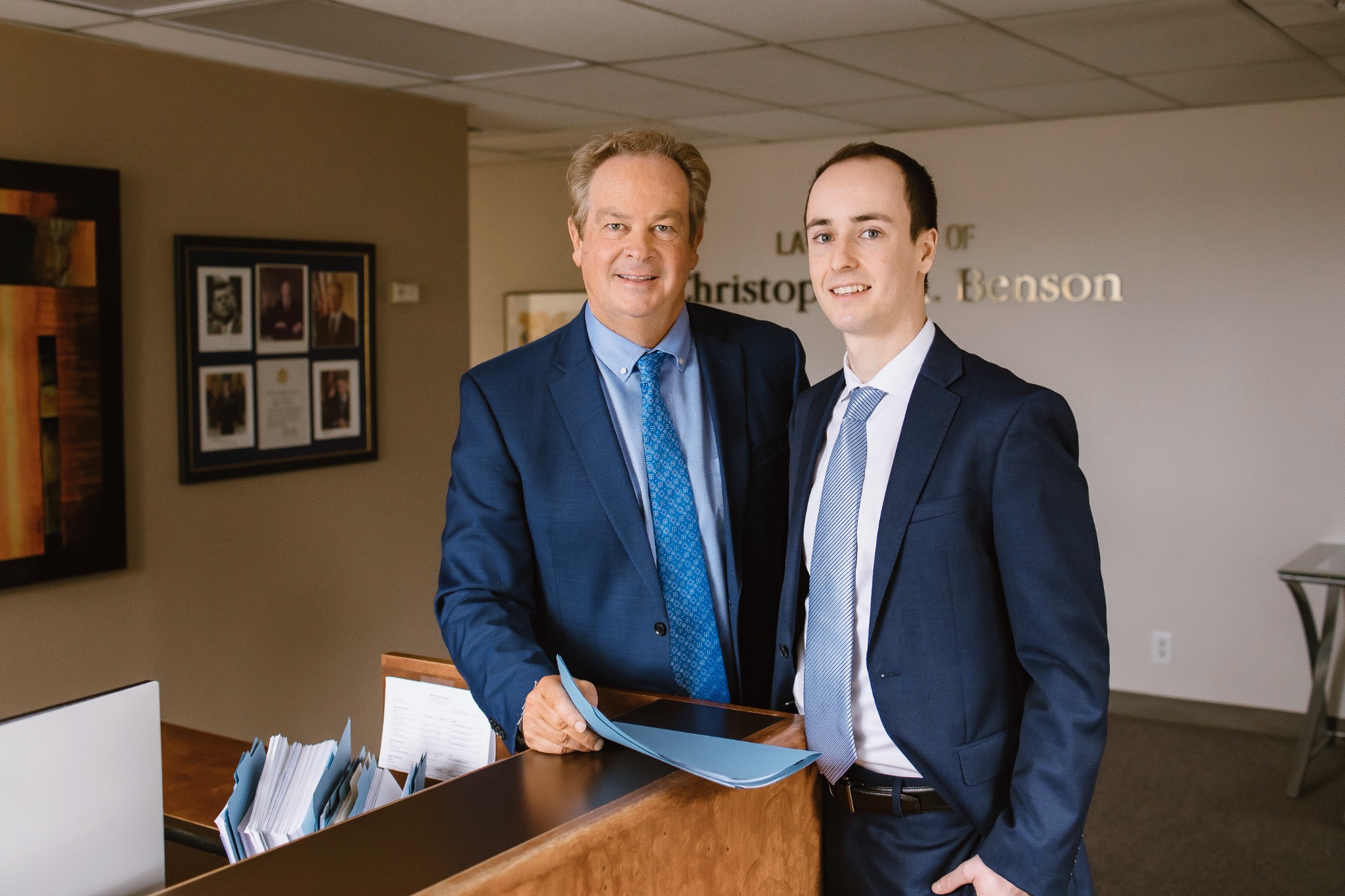 Chris and Logan at the law office front desk